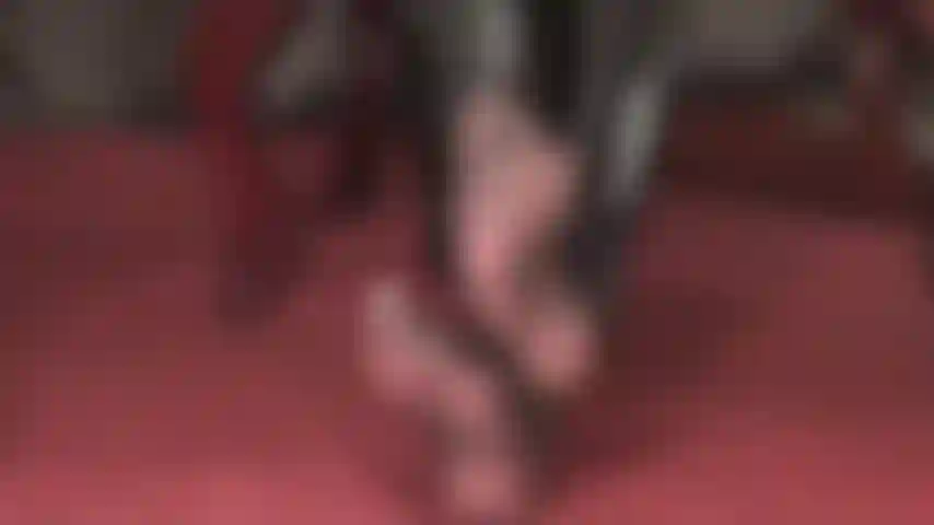 Mistress vivian shows off her fabulous feet in very sheer black pantyhose.