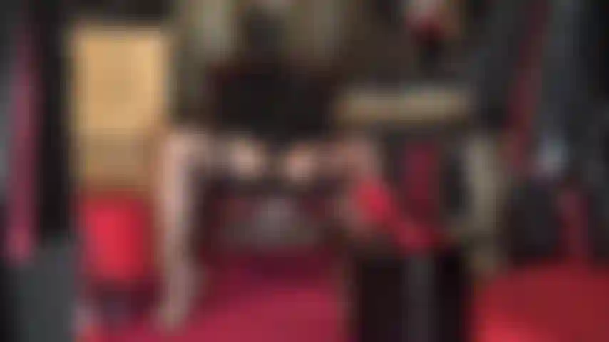 Hooded mistress with massive strapon - wearing hot stockings and garters, leather hat, spandex mask and leopard pumps, mistress vivian strokes her giant cock.