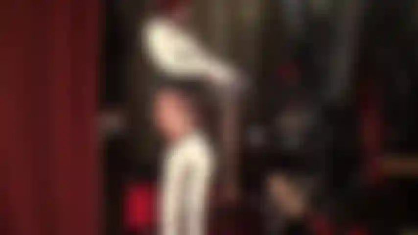 Sexy latex nurse layers several pairs of shiny nude pantyhose over latex stockings and tights.