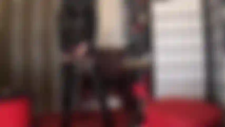 Lady in black - ass worship in stockings, garters, shiny pvc, boots and hat.