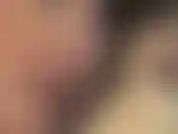 Extreme closeup of mistress' eyes and lips while she massages the cum from your cock using medical gloves.