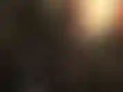 Latex fetish - hot black shiny rubber gloves up close.