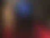 Ass worship in blue metallic leggings, tall black shiny boots and a white strapon in between.