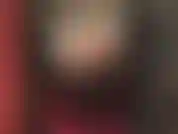 Short hair, shiny pvc outfit, tall boots and an 8 inch black strap-on.