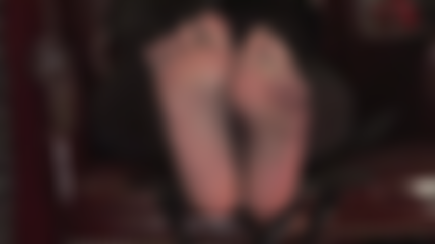 Sexy feet wiggle in off black sheer pantyhose teasing the foot slave.