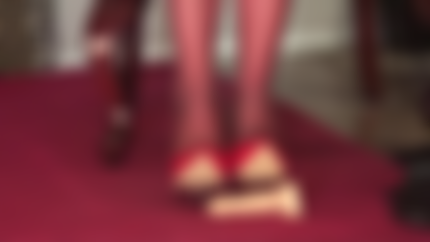 Shiny red patent pumps, pantyhose feet and riding crop to torment your slave cock.