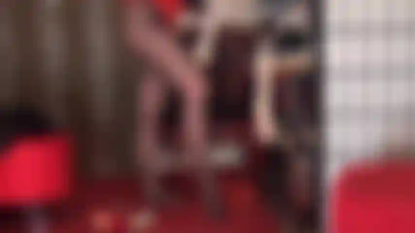 Silky white nylon lace top stockings tease. These nylons are layered on top of black sheer pantyhose and paired with shiny red stiletto pumps. Unbelievably sexy.