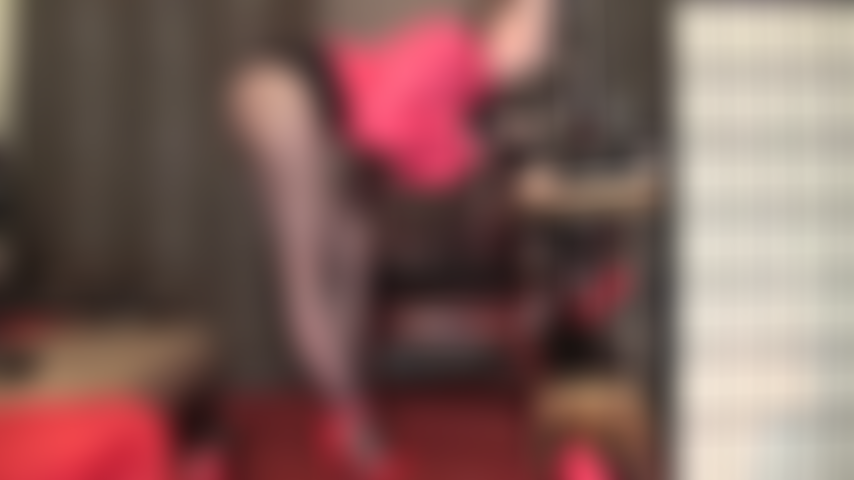 Mistress runs her gloved hands over a big cock while flaunting her incredible legs in sheer black pantyhose and strappy red stilettos.