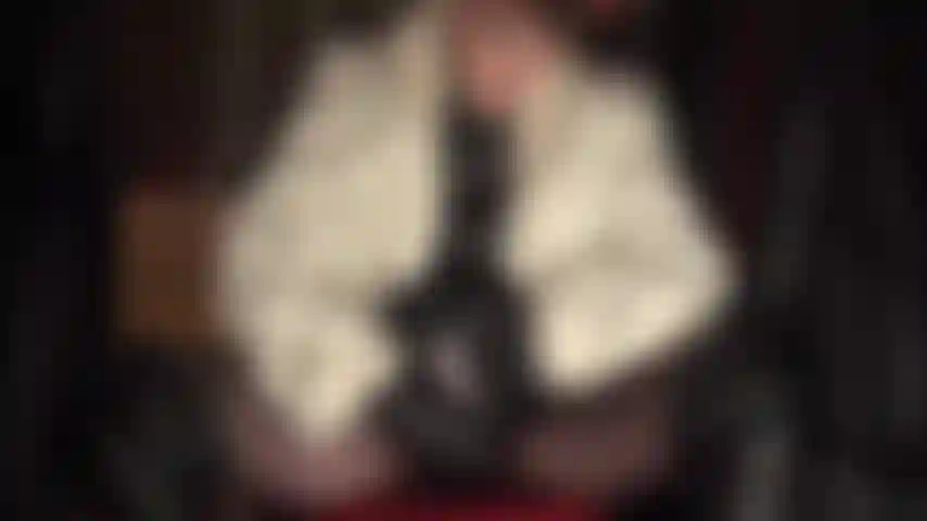 Mistress has you horny for her wonderful black leather and fur as she jerks her big cock.