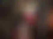 Hot rubber fetish outfit with medical mask, stockings and wide latex skirt under which mistress has a big cock to fuck you with.