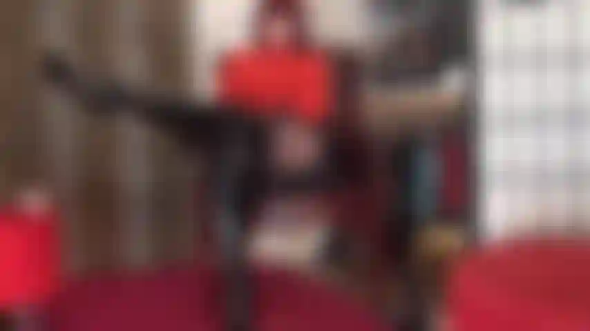 Body worship in this sexy outfit of red bodysuit, shiny vinyl skirt, black pantyhose and tall overknees black patent leather boots.