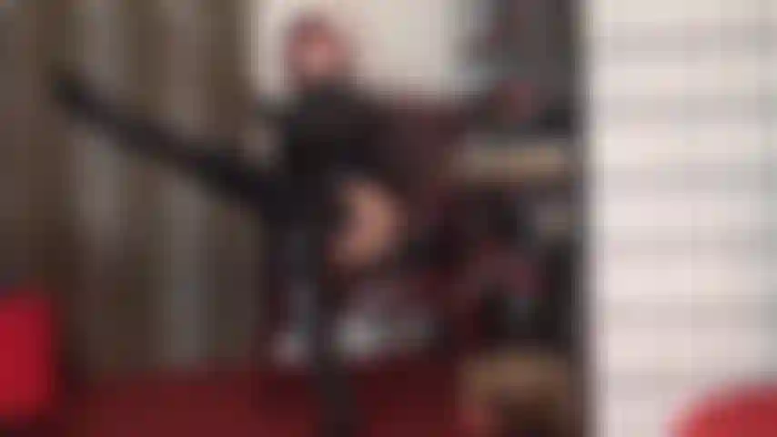 Cock tease in shiny overknees boots, pvc and stockings with garters over tan pantyhose - mistress' sexy shiny curves drive you crazy.