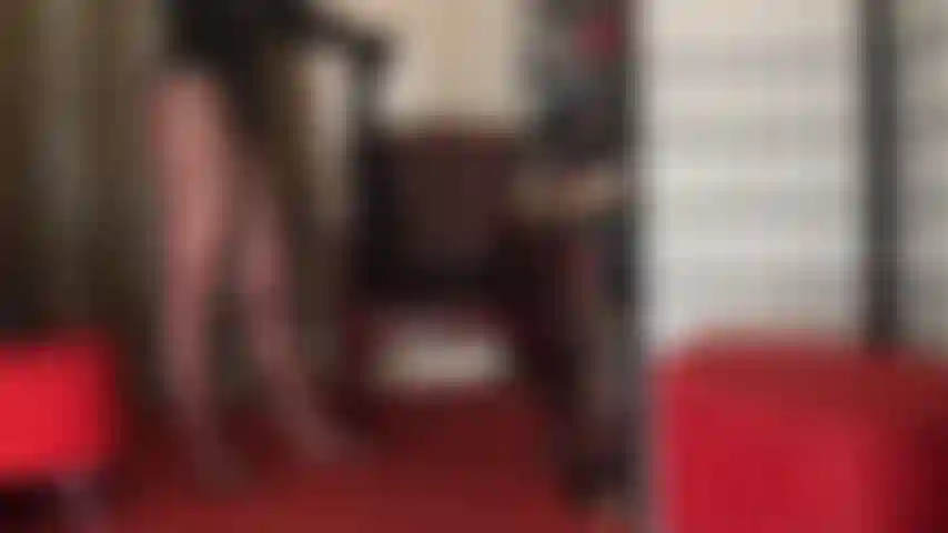 Irresistible legs in leopard printed garter look pantyhose and tall platform heels.