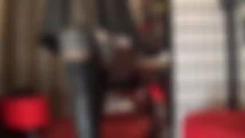 Leather goddess worship - mistress is dressed in beautiful black leather, tight mini skirt and tall overknees boots, stocking and pantyhose layers underneath.