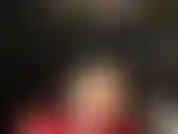 Blonde mistress in leather teasing with bare feet.