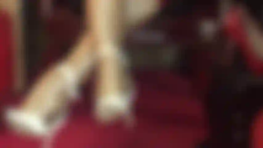 Incredible shiny pantyhose legs in golden nylon layers and white ankle strap sandals.