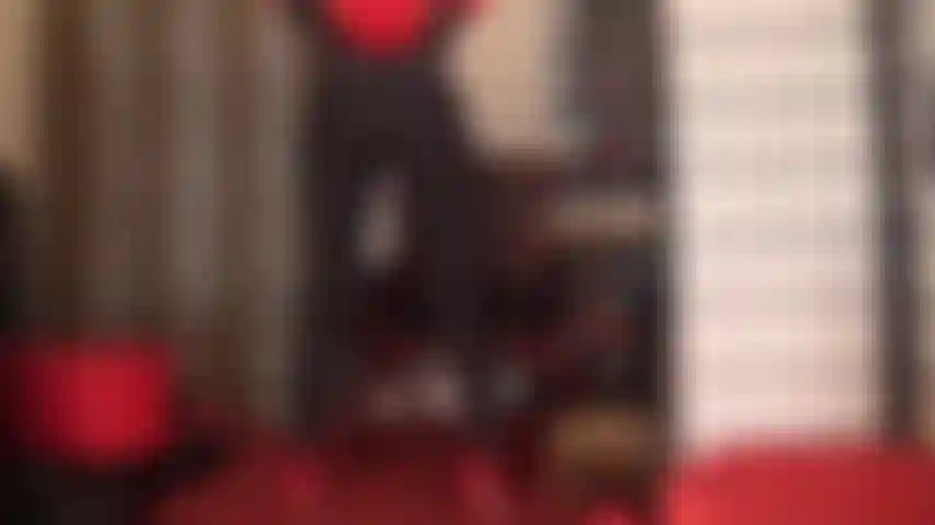 Ass worship in red and black - shiny black lycra leggings accentuate mistress' round butt.