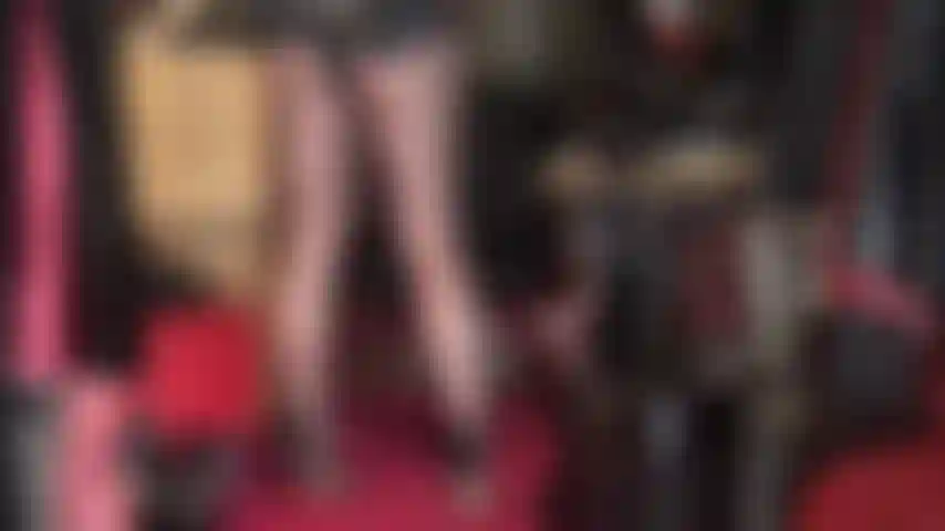 Mistress opens the zippers of her spandex bodysuit...