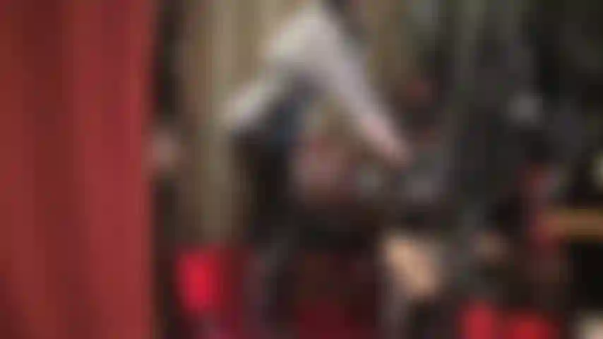 Glossy black pvc pants - mistress indulges in your fetish for vinyl jeans and turns you on by playing with the zipper and pockets, licking and kissing the fabric, in striped blouse and long hair wig.