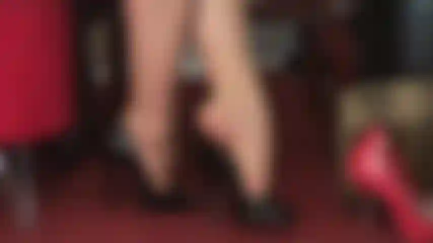 Foot fetish, high heel worship, dangling - beautiful shiny black peeptoes dangle from mistress' pantyhose toes.