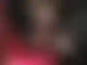 Skimpy little shiny shorts, long leather gloves and even longer legs in sheer black pantyhose.