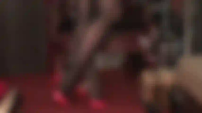 Extra glossy black oil sheen pantyhose and red high heel mules.