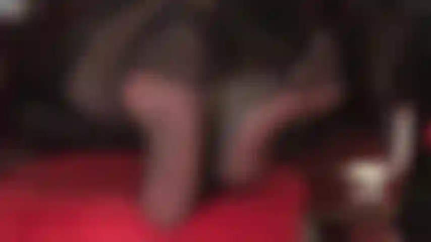 Crossed ankles, reinforced pantyhose, foot fetish, high heels, dangling, and leather gloves.