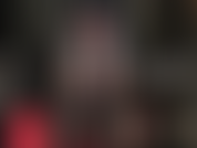 Red lace panties under black pantyhose.