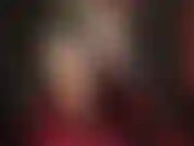 Pantyhose legs in short vinyl skirt with laced boots, and without.