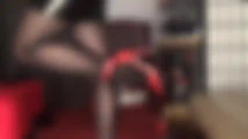 Enjoy this leg tease in black oil sheen pantyhose and red leather ankle strap pumps.