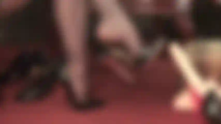 Shoe play and dangling with black high stiletto pumps.