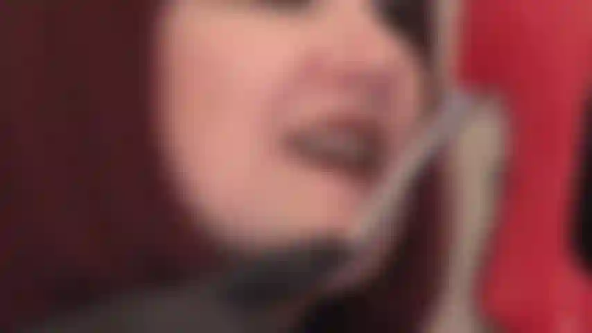 Black leather gloves, lipstick lips and tongue on shiny metal stiletto pumps.