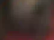 Dressed in full leather, gloves, boots, skirt, long coat. Amazingly beautiful.