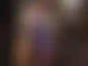 Your latex goddess shows off a sexy outfit with top and rear laced skirt in shiny metallic purple rubber.