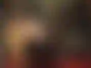 Black wig and shiny pvc/vinyl fetish outfit with tall boots and huge strapon for a hard pegging.