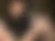 Stroking white uncut dildo with bare hands.