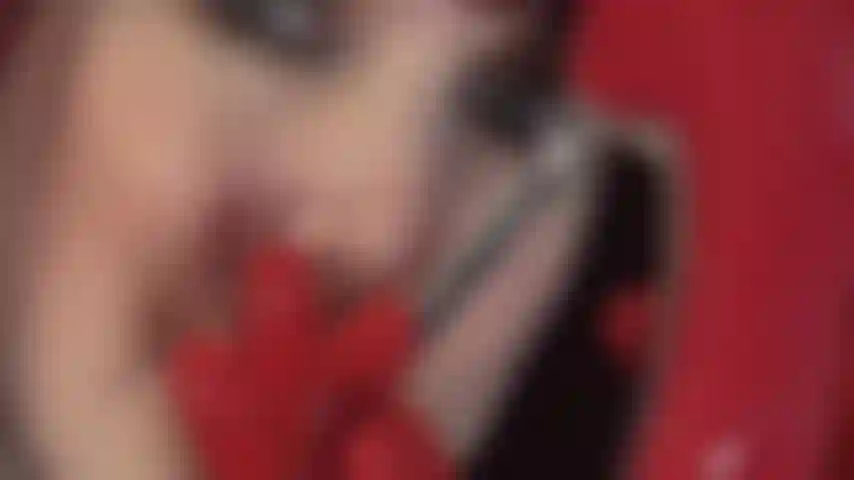 Kinky red latex fetish gloves on red steel heel patent pumps and black cock tease.