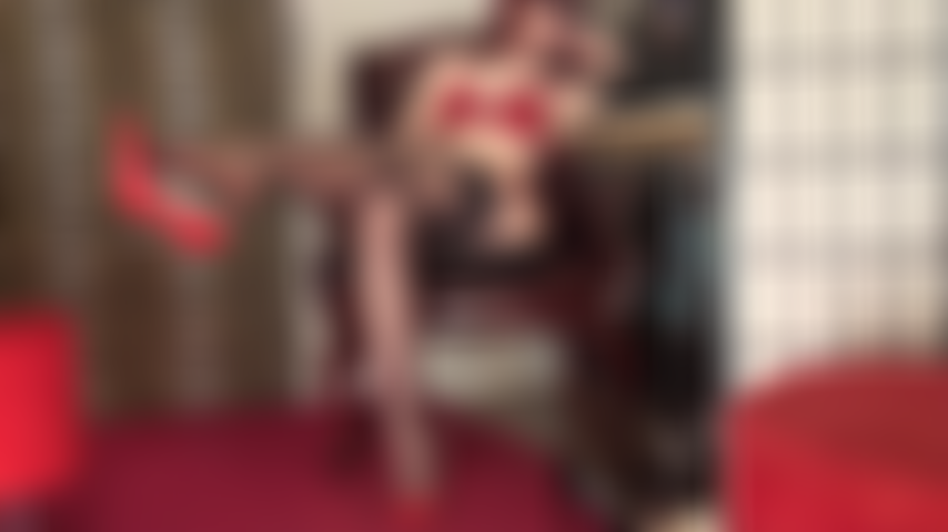 Foot tease and dangling red heels in sexy lingerie, sheer black lace top stockings and red bra and panties.