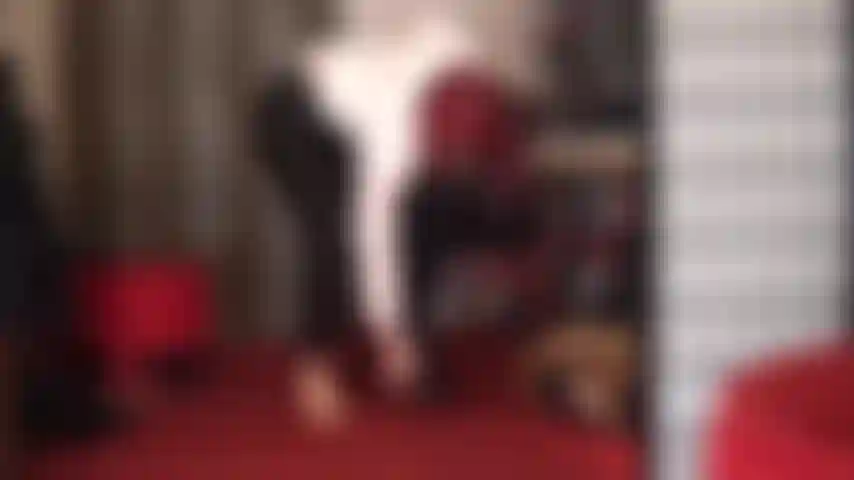 Outfit change from pretty blouse and leggings to shiny pvc boots, jacket and gloves.