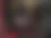 Kinky latex mistress with hood, gloves, boots and big white strapon.