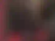 Kinky latex fetish goddess in black rubber catsuit with hood and bbc strapon.