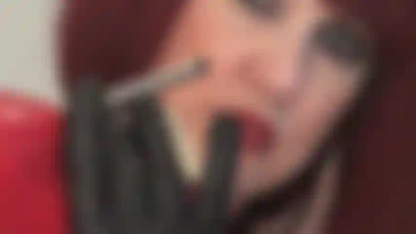 Stiletto seduction - your desire to lick these shiny silver heels is huge. Mistress teases with her mesmerizing eyes, tongue and leather gloves on red glossy pumps.