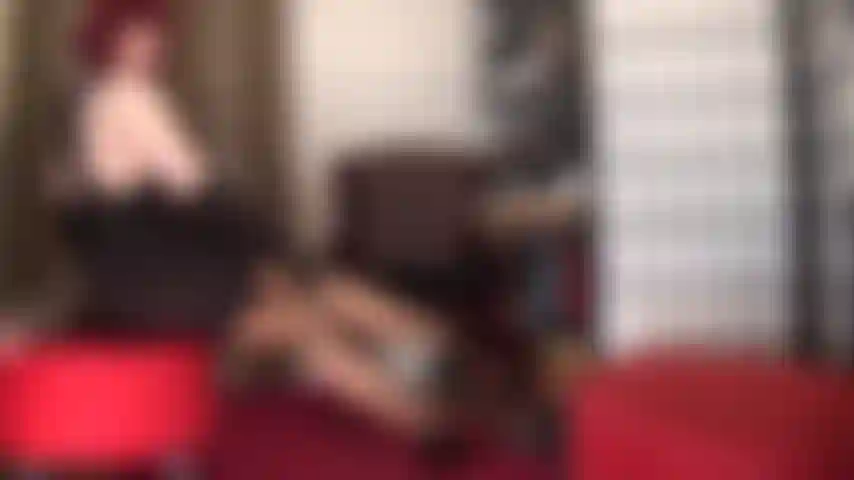 Seductive tease in brown stockings, garters and lace lingerie.