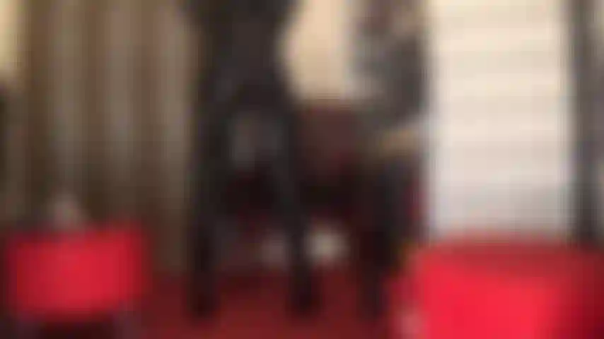 Kiss mistress' incredibly hot ass in tight shiny pvc jeans and overknees boots.