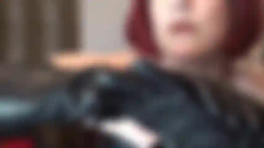 Beautiful leather temptation - black leather on pale white skin. Mistress vivian teases with bare shoulders, leather corset and shoulder length gloves.