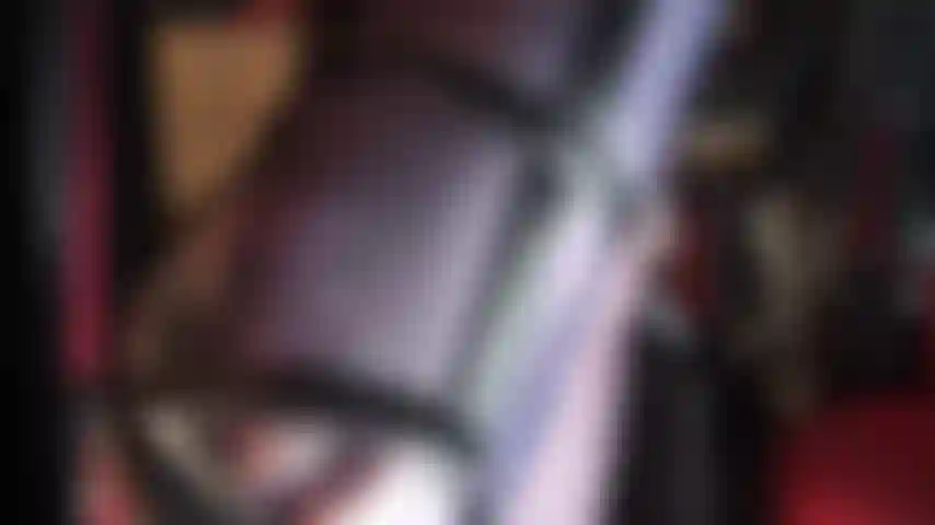 Sexy long nylon legs and pretty toes in navy blue glossy pantyhose and strappy stiletto sandals.