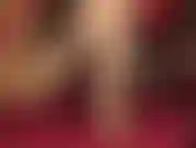 Glossy golden pantyhose legs dangling low leather mules, teasing cock with feet and gloved hands.