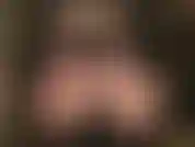 Sensual ass worship seduction - dressed in nylon layers, pantyhose over stockings, mistress runs her gloved fingers along her perfect round ass in nylons and bare, hose lowered, in a tiny thong.