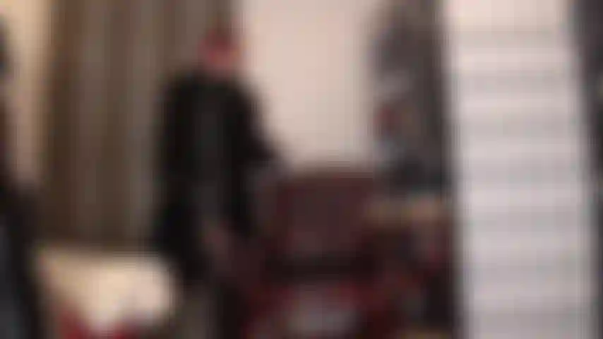 Fur lover - here is a wonderful mix of fabrics, mistress dressed in all black, shiny pvc dress, leather gloves and long fur coat, legs in black pantyhose and knee boots.