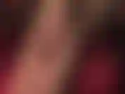 Slipping on black sheer pantyhose and black pants, teasing in closeup with sexy soft nylon soles and toes.